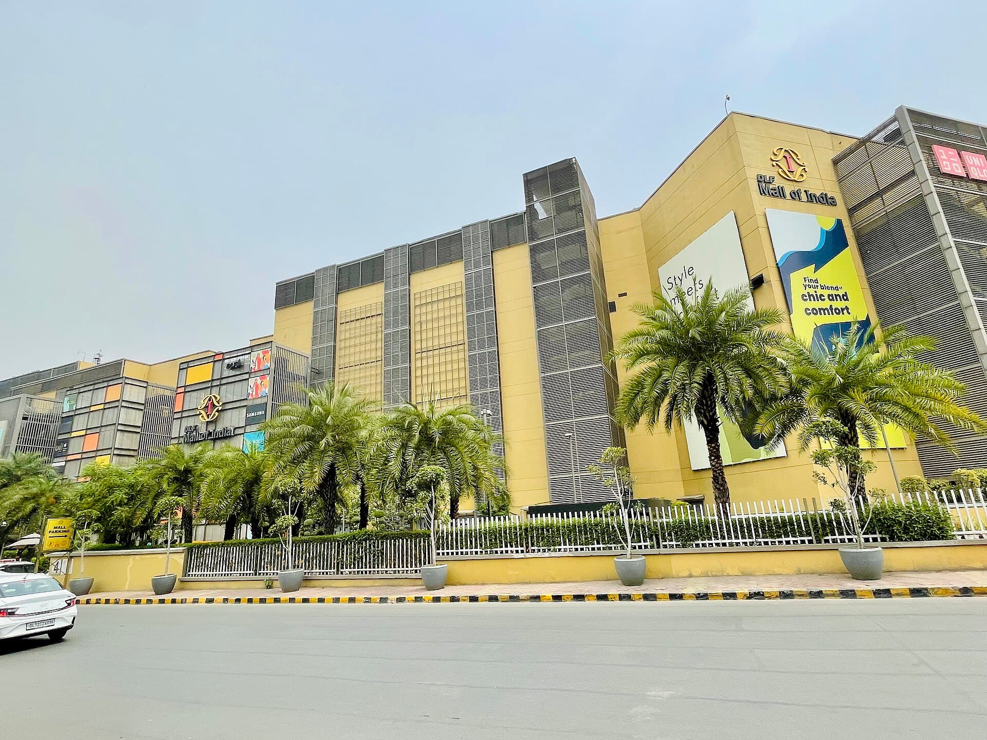 DLF Mall of India building lined with palm trees in Sector 18, Noida